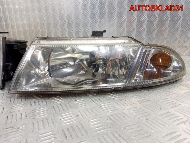 Фара левая правая Mitsubishi Carisma DA MR485383