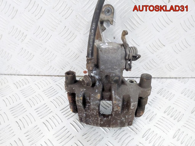 Суппорт тормозной задний правый Nissan Primera P12