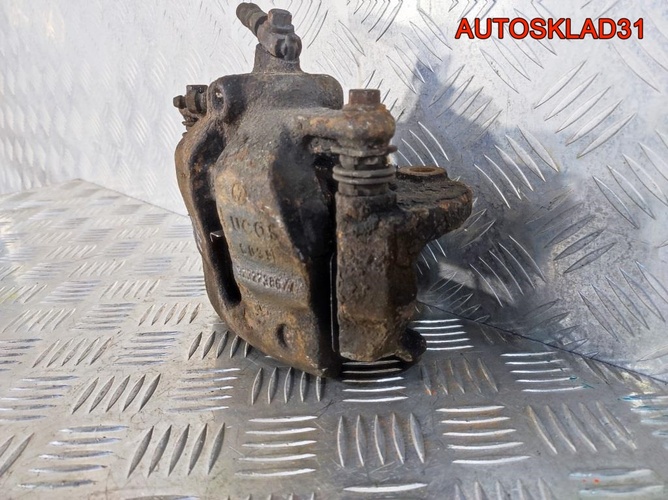Суппорт тормозной передний правый VW Polo HB